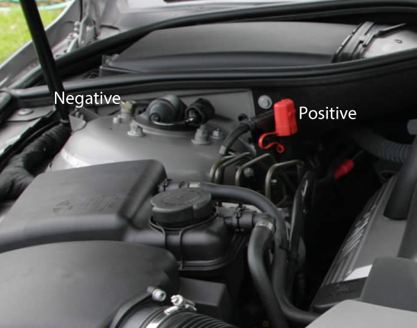 Where is the negative terminal for a bmw x5 battery